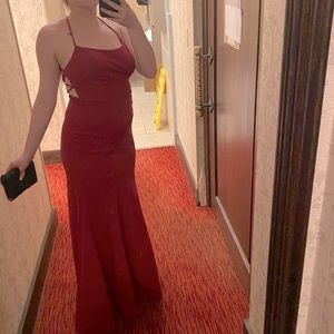 Only worn once! Beautiful red dress with ties in the back to adjust.